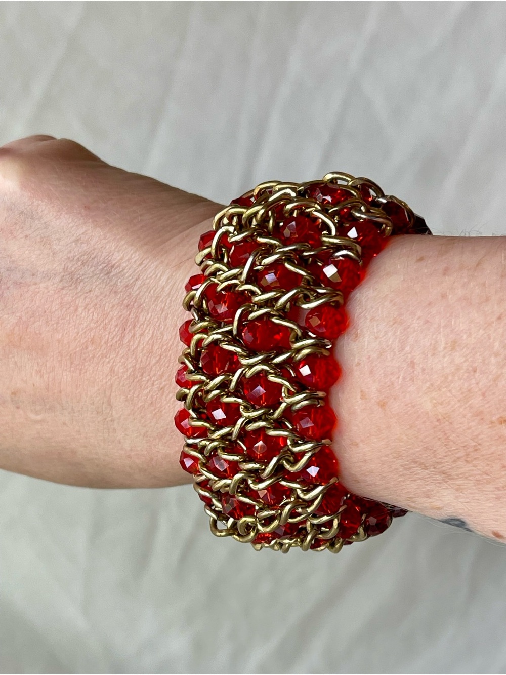 Chunky Stretchy Gold Tone Chain Bracelet with Red Faceted Beads